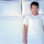 Man laying on bed, wide awake, re story